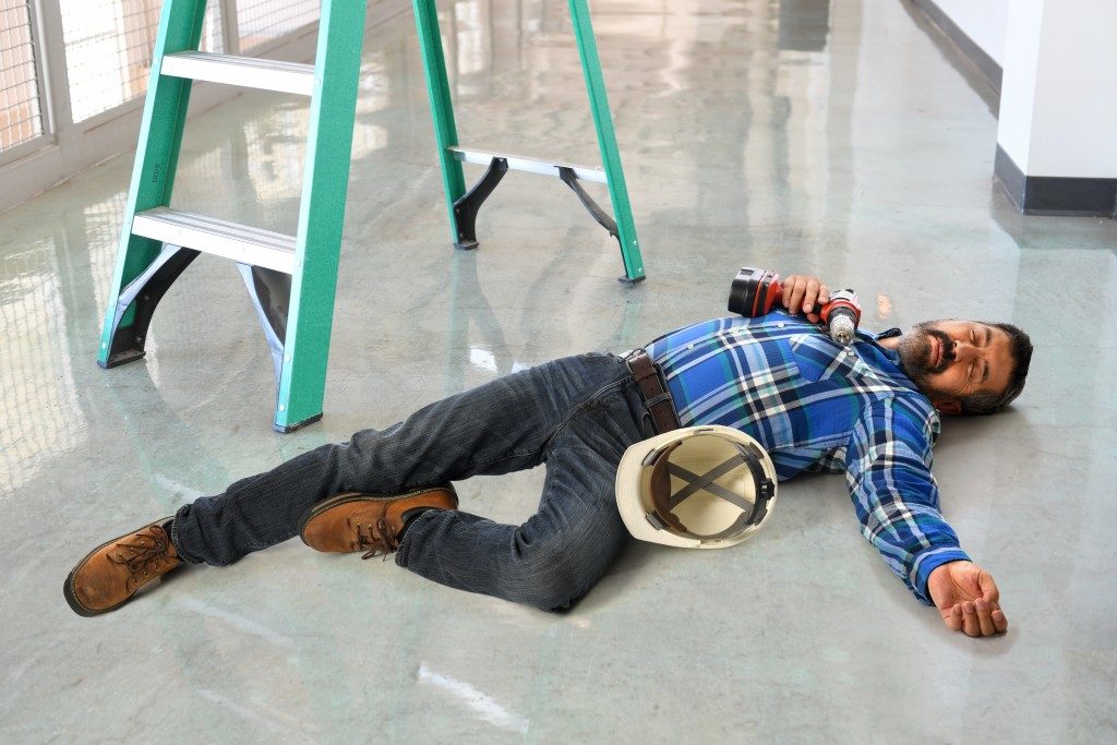 Employee lying on the floor due to an accident