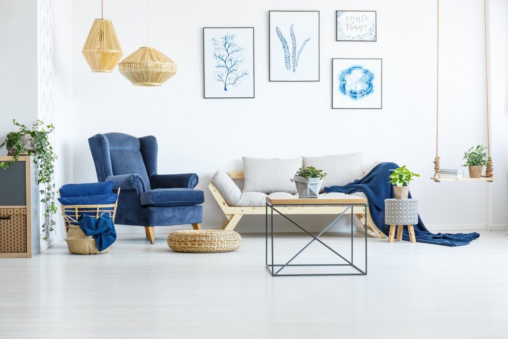 white living room with blue furniture