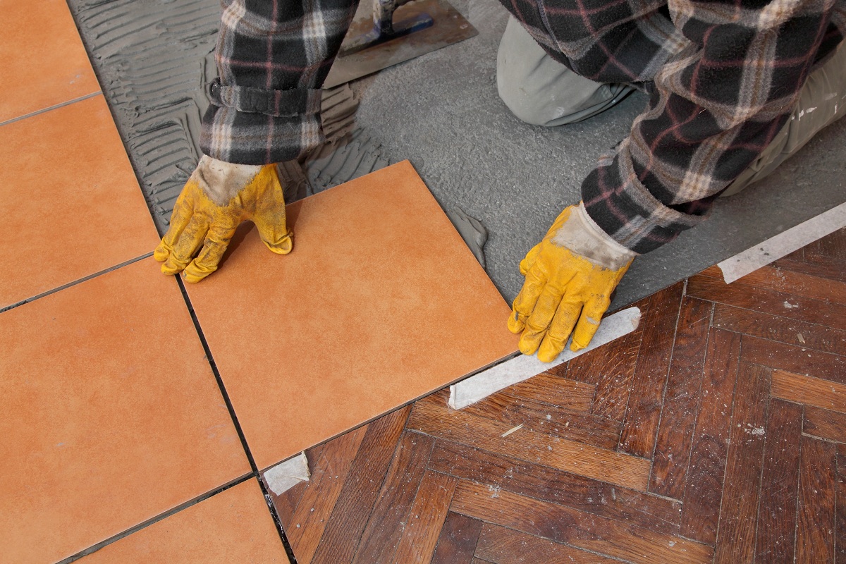 man installing tiles