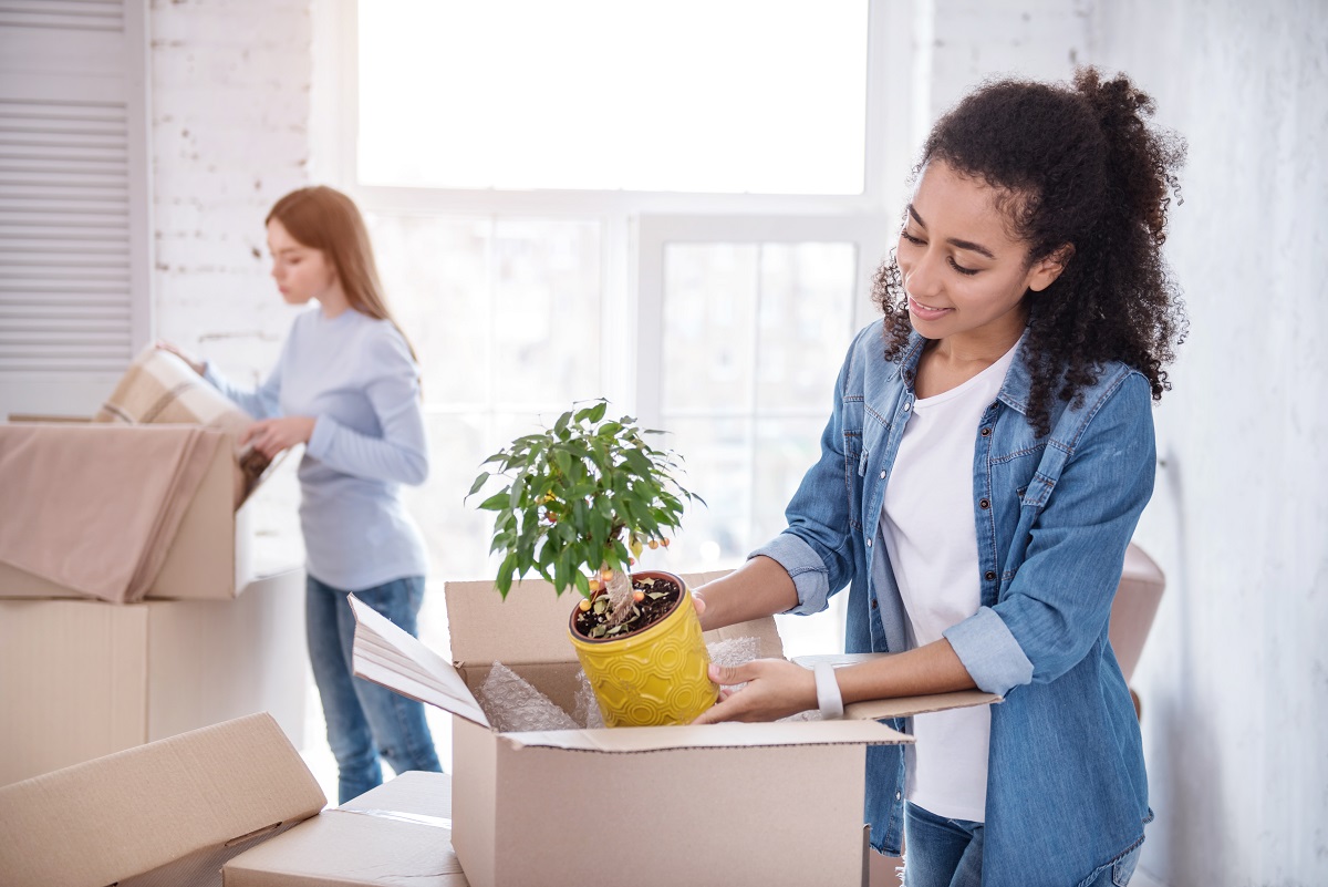 girl putting things on a box