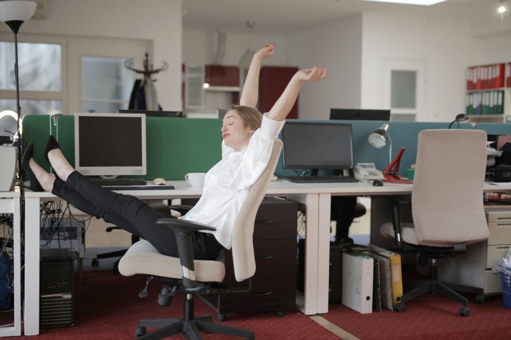 woman stretching at work