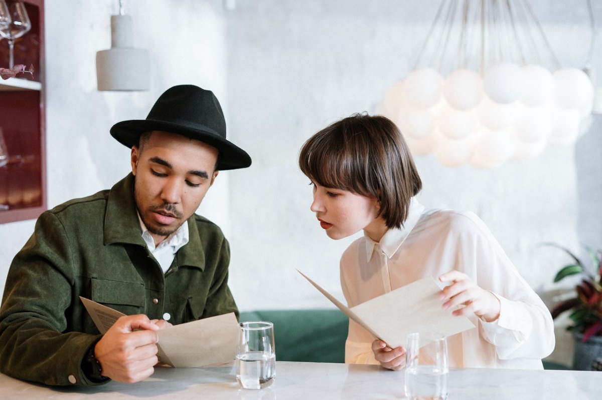 people looking at the menu